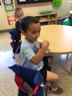 Ben enjoys applesauce.jpg