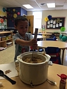 Ben stirs applesauce