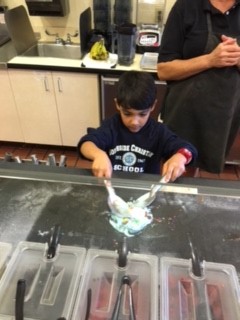 Josue mixes ice cream.jpg